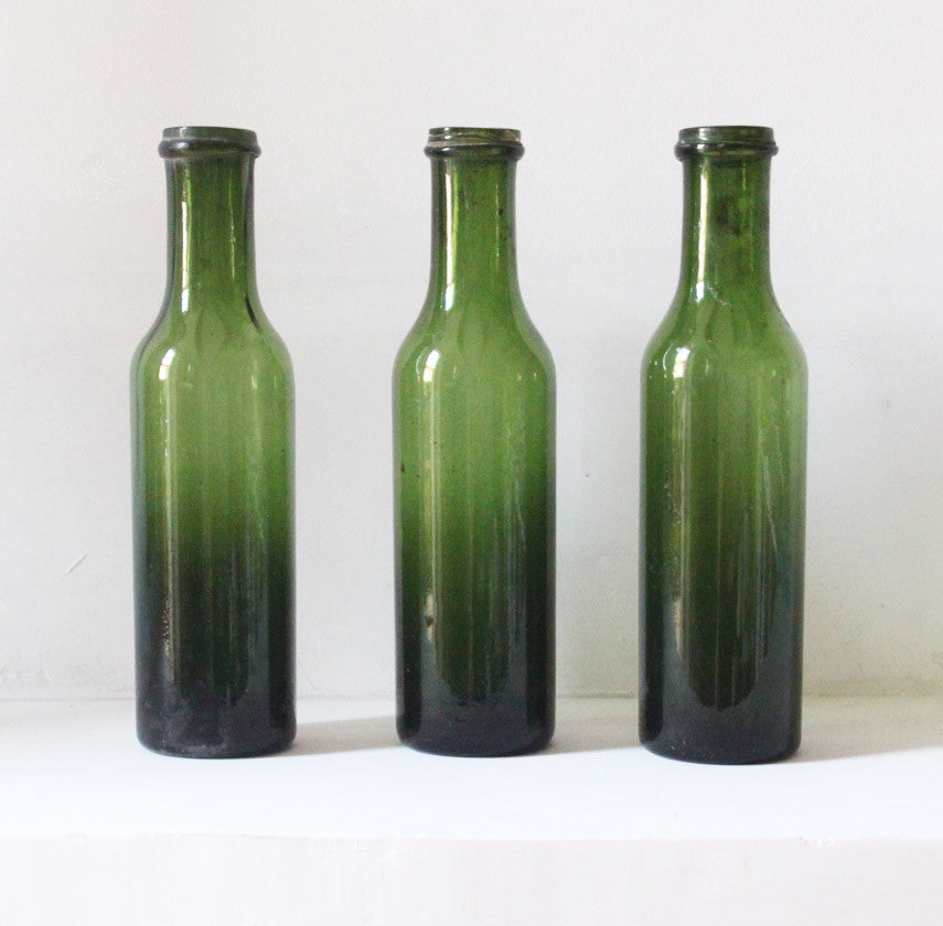 SOLD ! set of 3 tall green glass bottles (vintage find)Vintage- Cachette